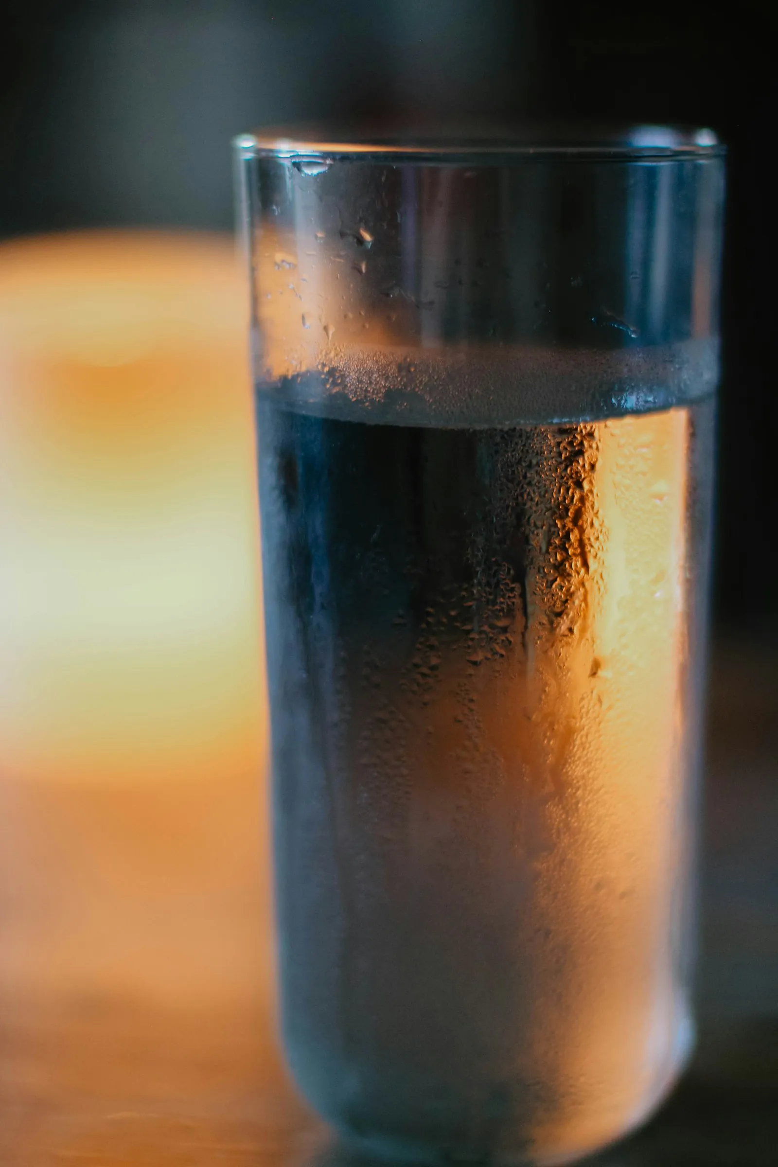 A clear glass of water in warm natural light